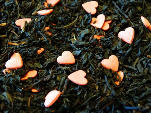 Black tea, peach, dried fruits, decoration small hearts